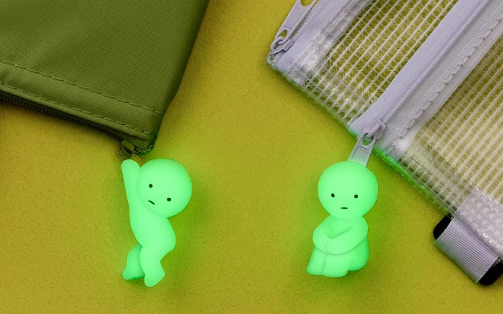 a couple of green items sitting on top of a table
