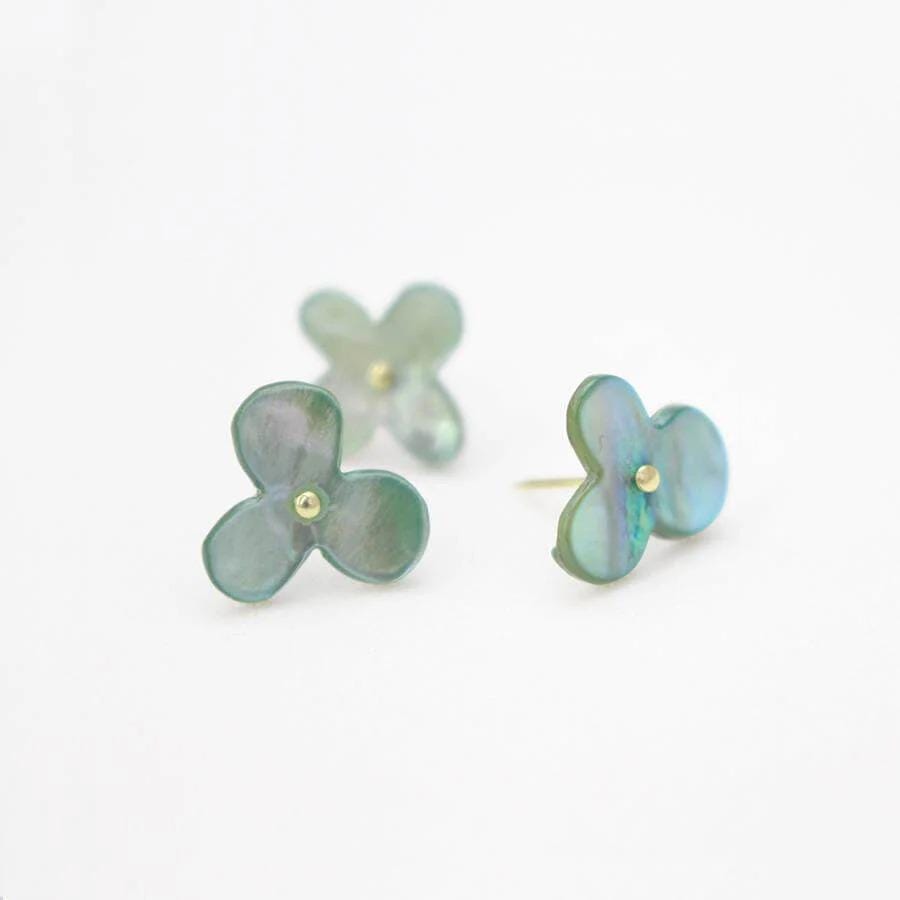 Three green flower-shaped earrings with gold accents are displayed against a white background.