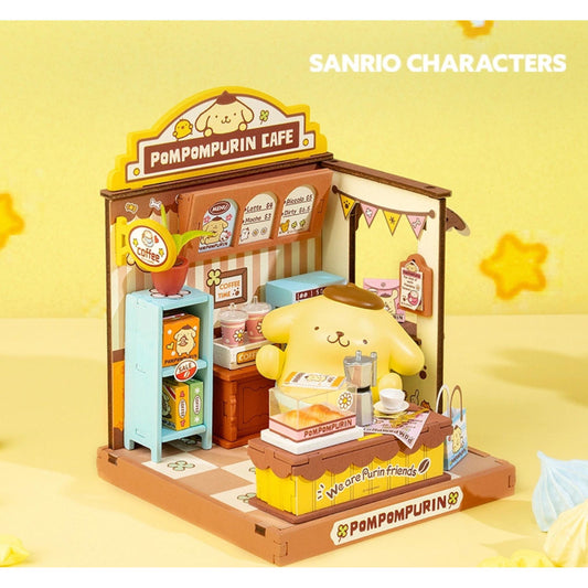 A small toy cafe with a yellow pom-pom character sitting at the counter, surrounded by various toy items and accessories.