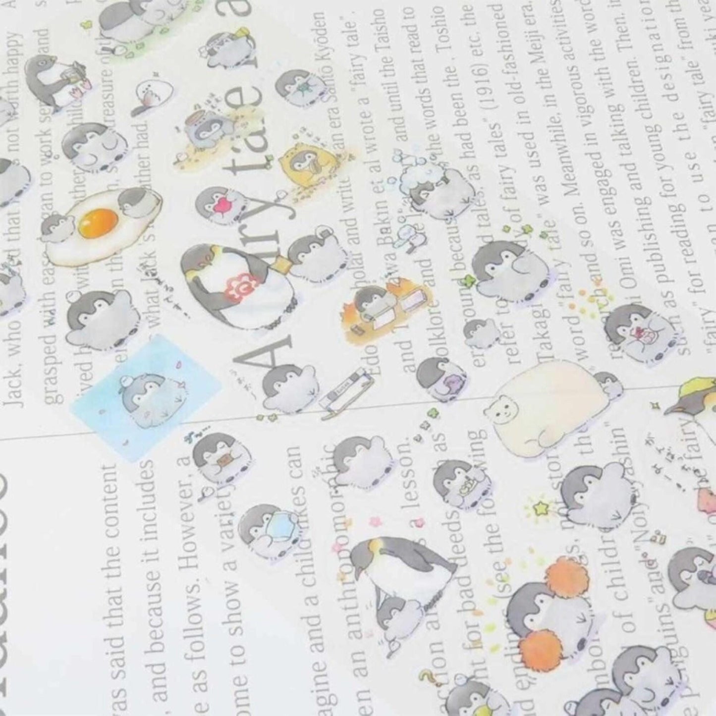 a collage of various cartoon penguin stickers on a page, with some text visible in the background.