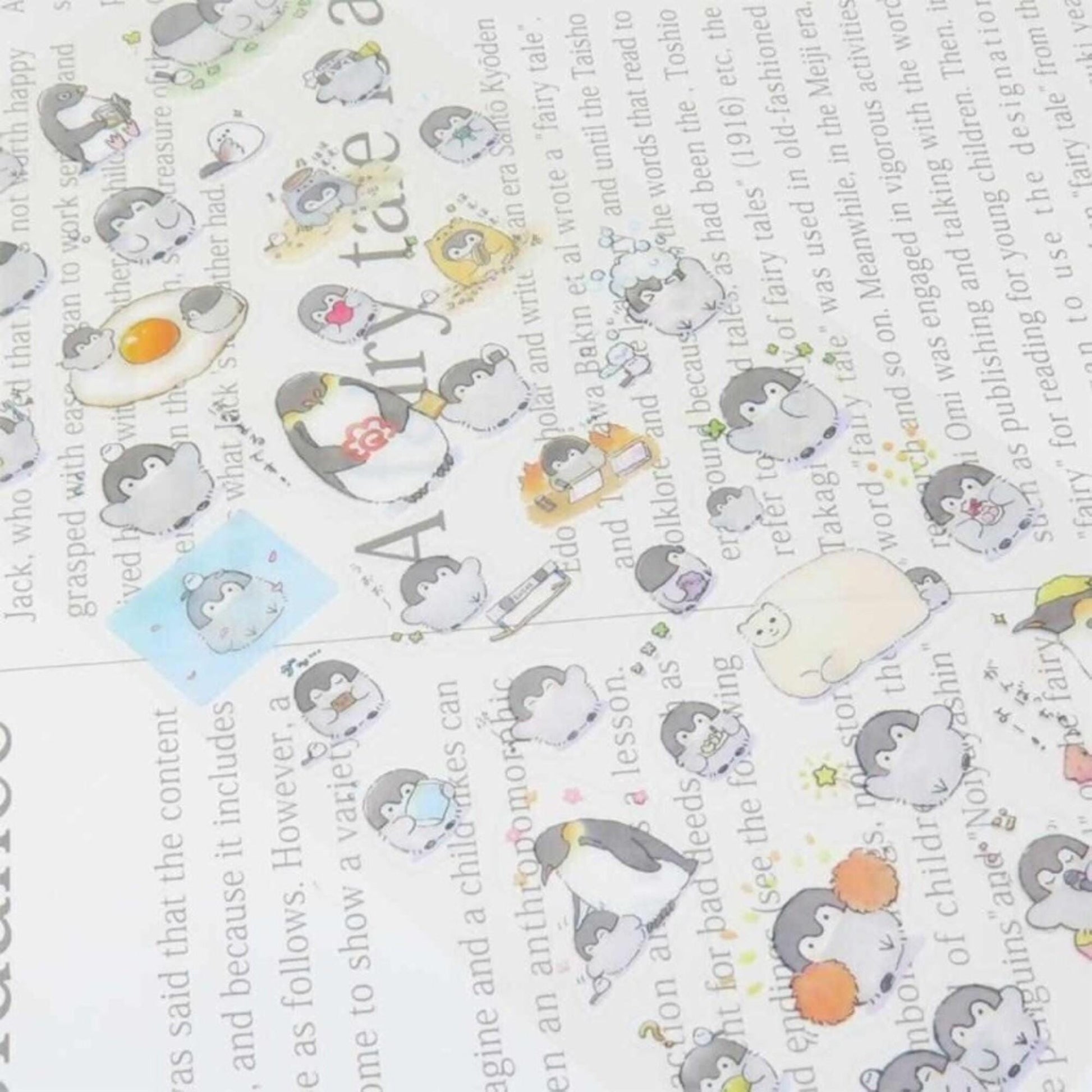 a collage of various cartoon penguin stickers on a page, with some text visible in the background.