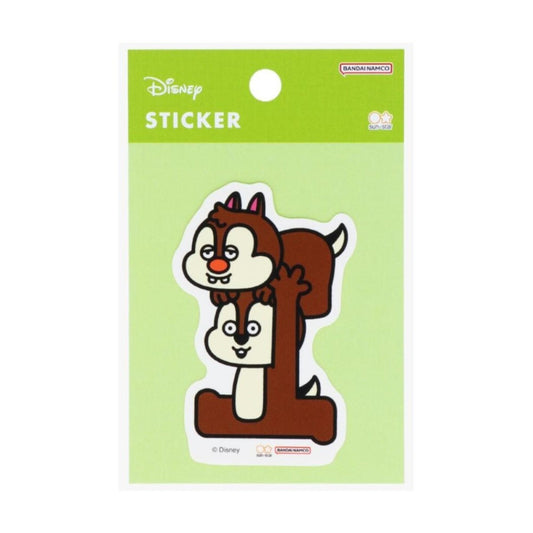 A sticker depicting two cartoon chipmunks, one brown and one white, against a green background.