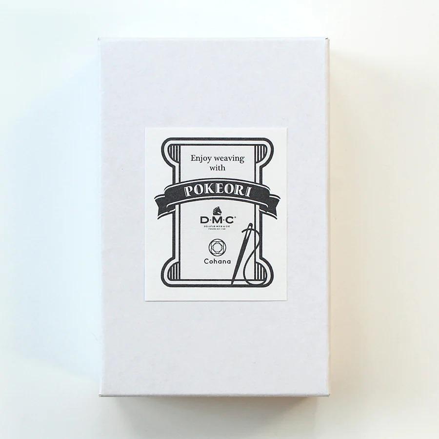 a white box with a label that reads "Enjoy weaving with POKERI" and "DMC" along with the text "Conhara".