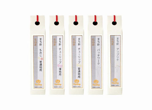 five identical white boxes with red handles, each containing Japanese text and a logo.