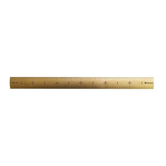 a gold-colored ruler with black markings on a white background.