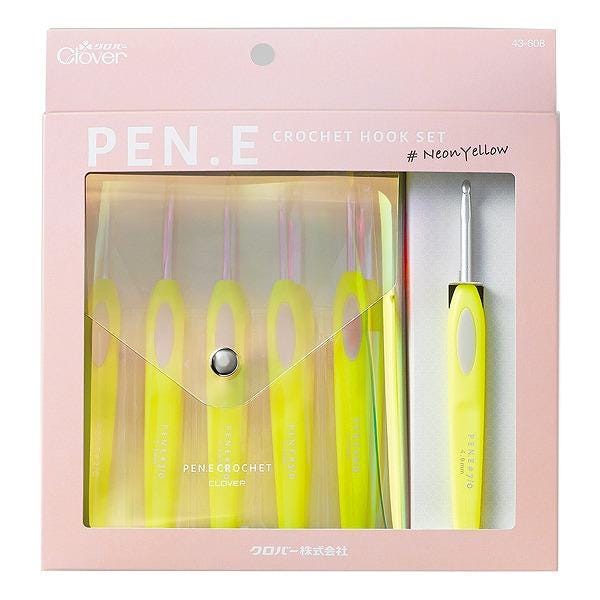 A pink package containing a set of yellow crochet hooks and a crochet hook.