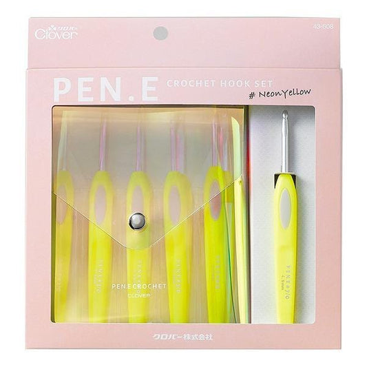 A pink package containing a set of yellow crochet hooks and a crochet hook.