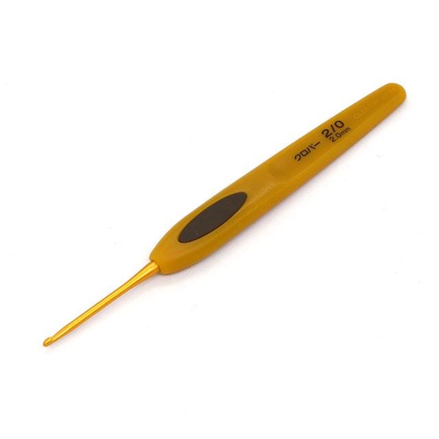 A yellow crochet hook with black text on it.