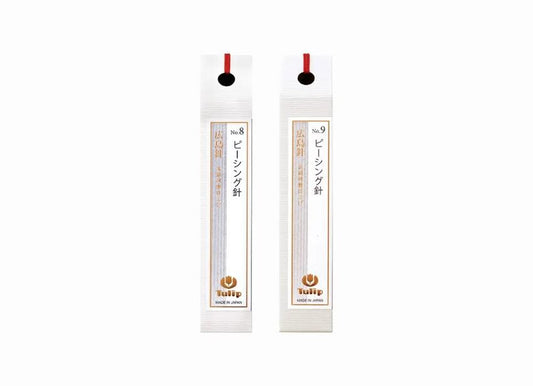 two identical white pencil holders with red and gold accents, each featuring Japanese text and a logo.