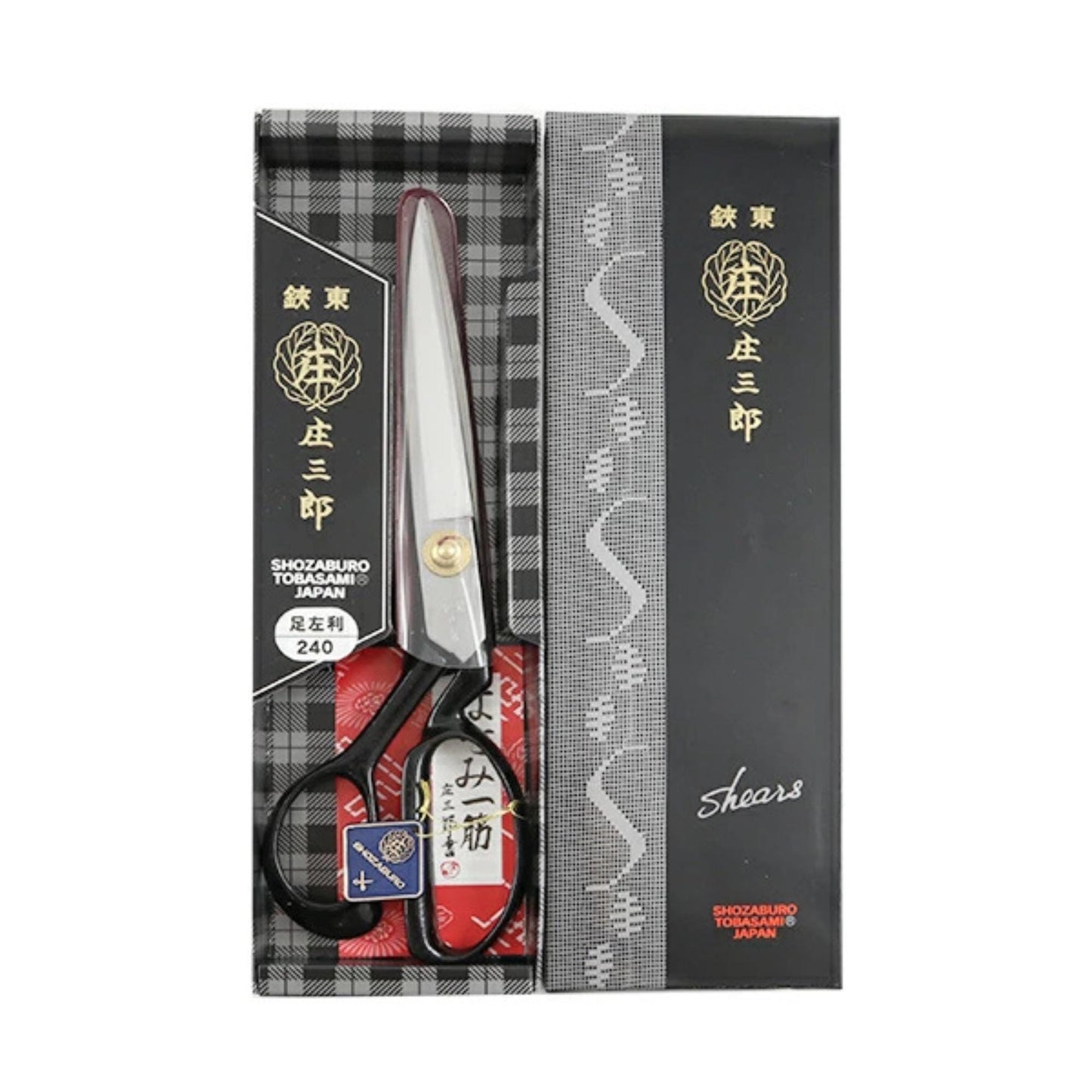 A pair of Japanese scissors with a black and white checkered box and a black and white patterned sleeve.