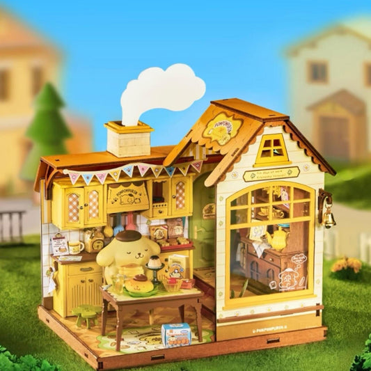 A small, colorful dollhouse with a kitchen scene inside, featuring a yellow dog sitting at a table with a cake.