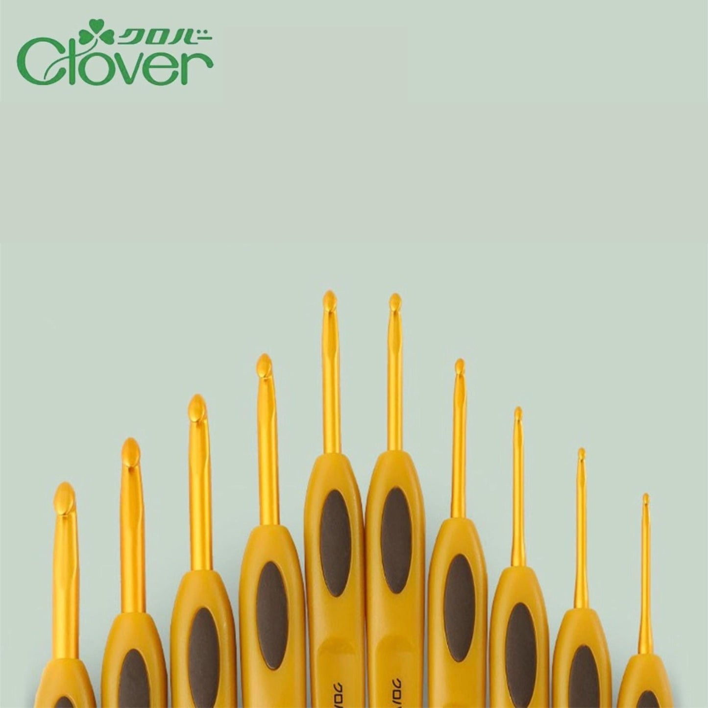 A collection of yellow crochet hooks arranged in a row against a light green background.