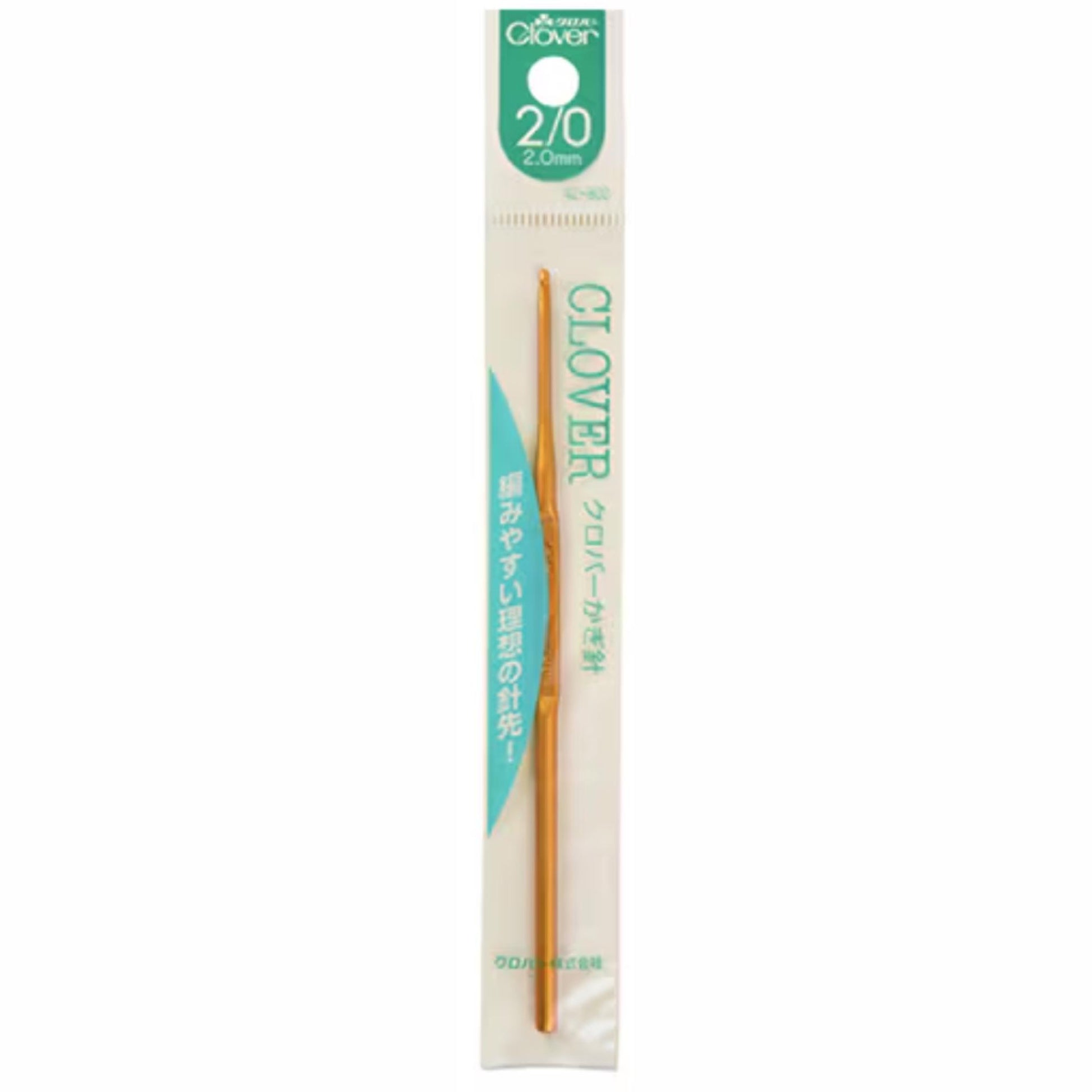 A gold-colored crochet hook is shown in a package with Japanese text.