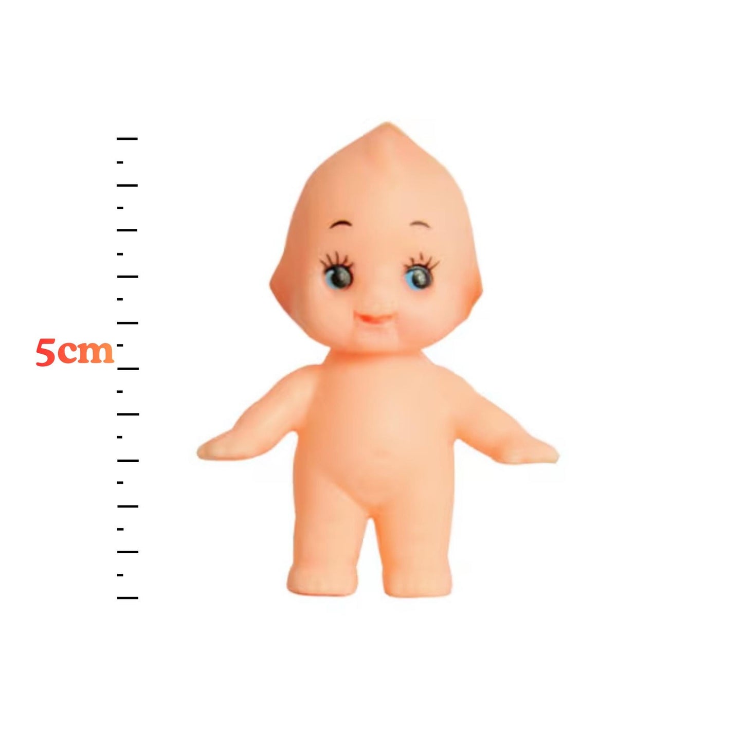 A small toy doll with a smiling expression is shown next to a ruler for size reference.