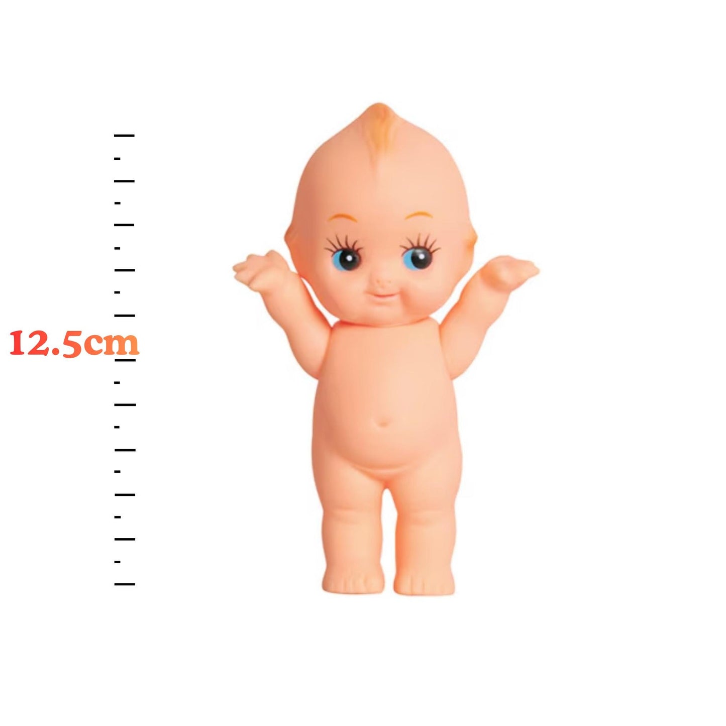 A small toy doll with a smiling expression and raised arms, standing next to a ruler for size reference.