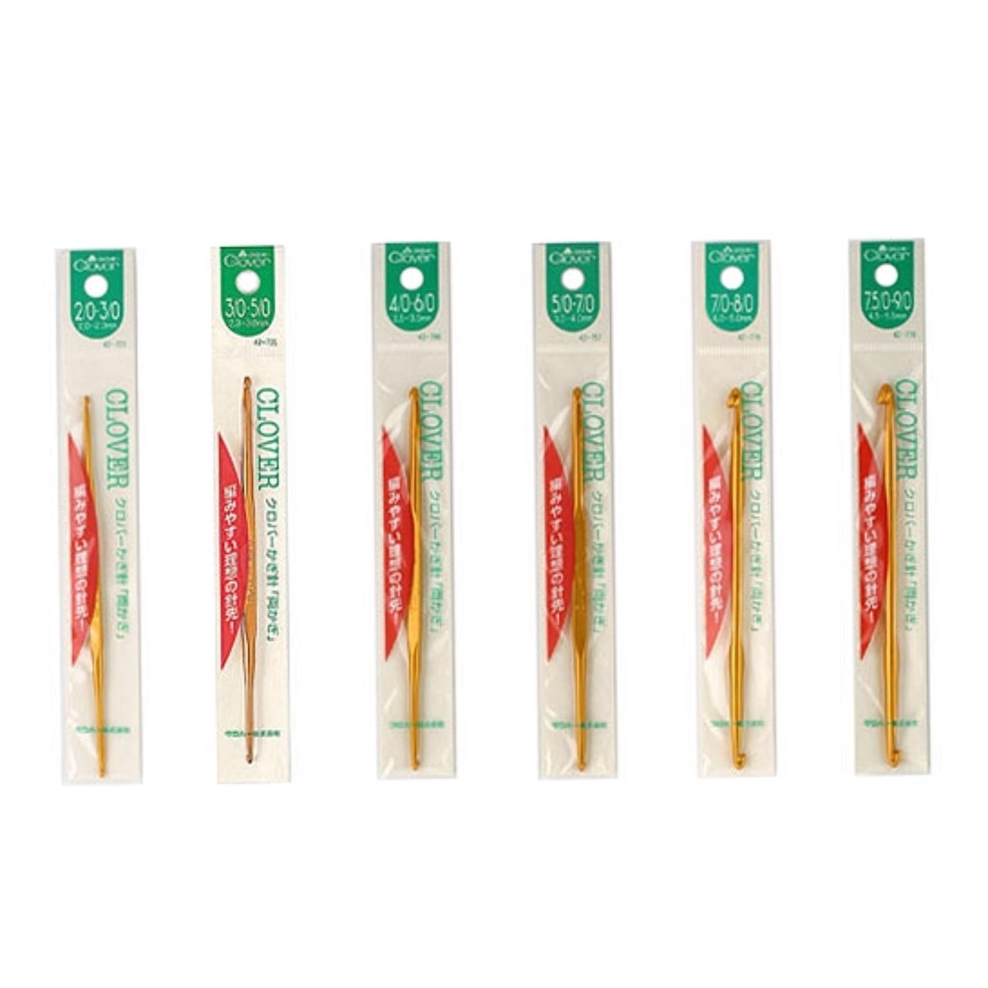 six crochet hooks in their packaging, arranged in a row.