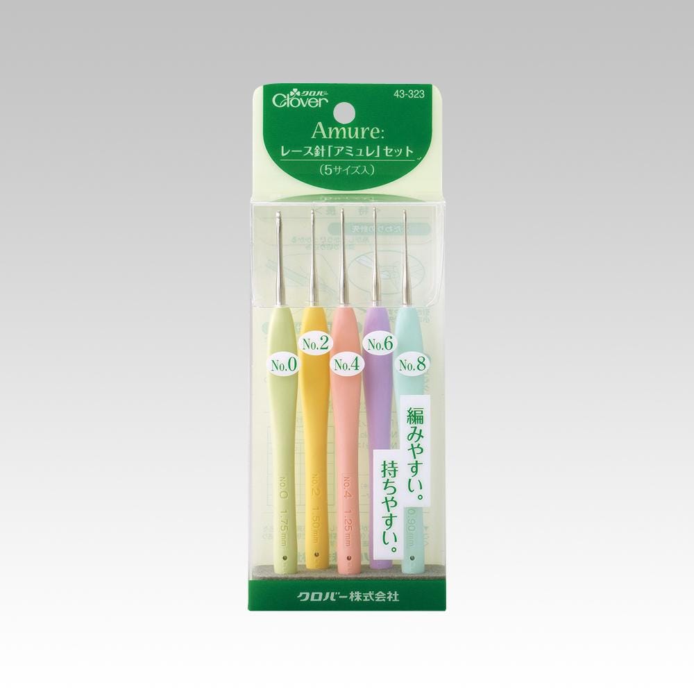 A package containing five crochet hooks in various pastel colors, including yellow, pink, green, blue, and purple.