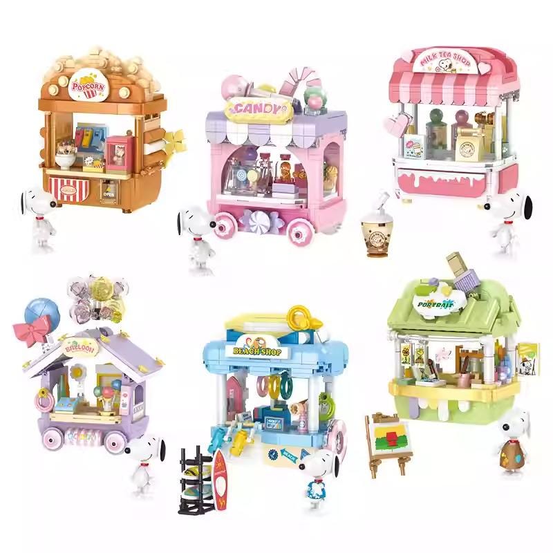 six colorful toy vending carts, each with different designs and accessories, including a popcorn machine, a candy machine, and a tea shop.