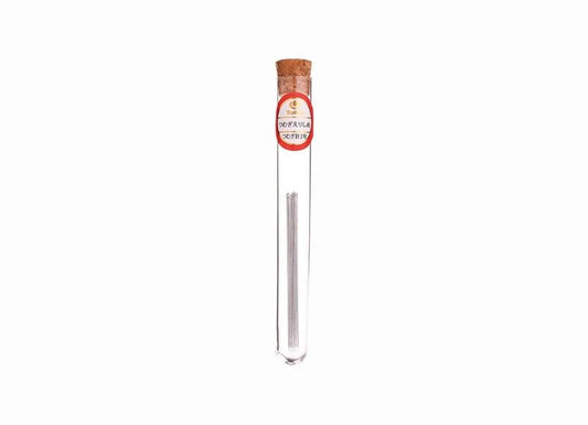 A clear glass tube containing a small object, with a red and white label on the top of the tube.