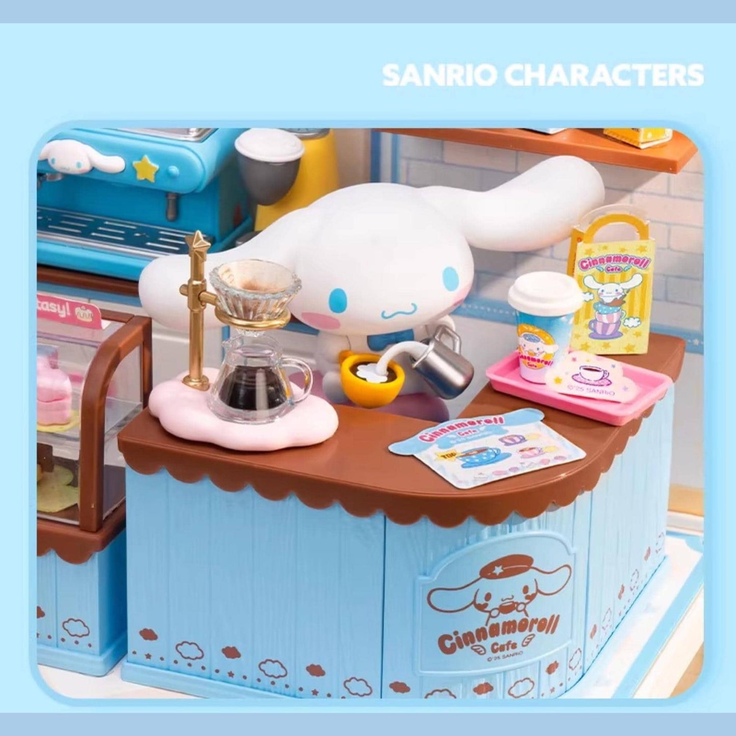 A toy cafe set featuring a cute, cartoonish character, likely a character from the Sanrio brand, with various items such as a coffee machine, cups, and other accessories typically found in a cafe.