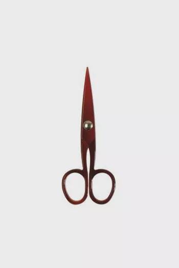 A pair of red scissors with a silver button on the handle.