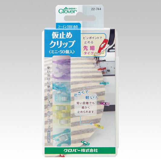 The image is a product packaging for a product called "Clover Clothespin". The packaging features a variety of colorful clothespins and a clear plastic window.