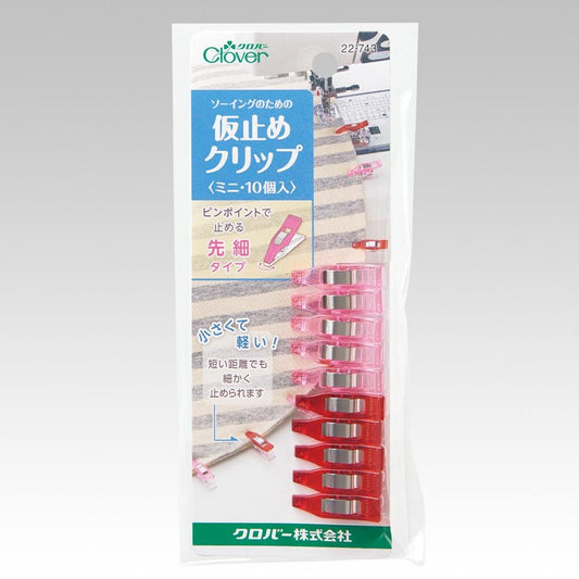 The image is a product packaging for Clover Clothespins, featuring a collage of images including clothespins, a sewing machine, and a kitchen setting.