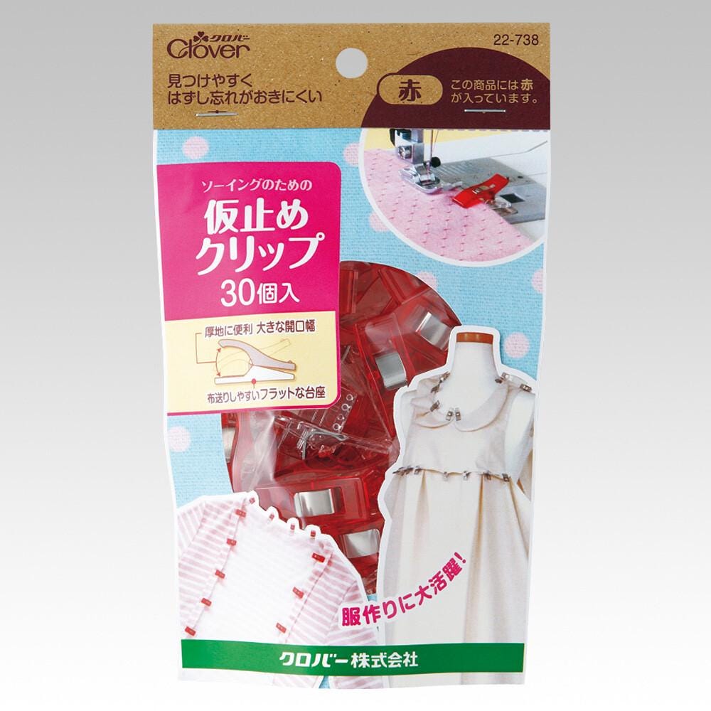 The image is a package for a sewing machine with various sewing tools and accessories, including a sewing machine, scissors, and other sewing-related items.