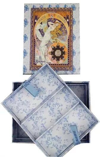 a decorative box with a floral pattern and an ornate, colorful painting of a woman on the lid.