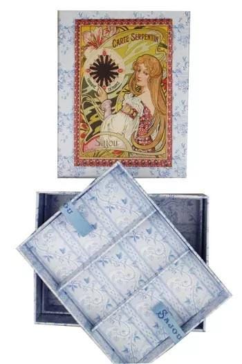 a decorative box with a floral pattern and a woman's portrait on the front. The box is open, revealing its contents.