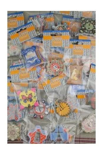 a variety of colorful and patterned items, including small toys, trinkets, and other decorative objects, all packaged in clear plastic bags.
