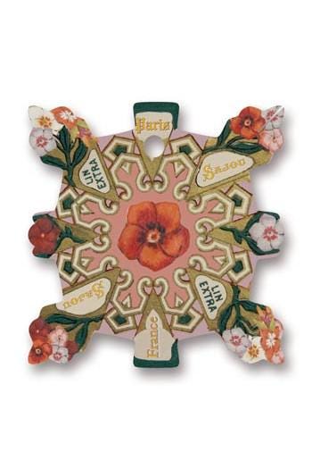 The image is a decorative piece featuring a floral design with a large red flower at the center. The design is surrounded by various floral elements, including smaller flowers and leaves, creating a visually appealing and intricate pattern.
