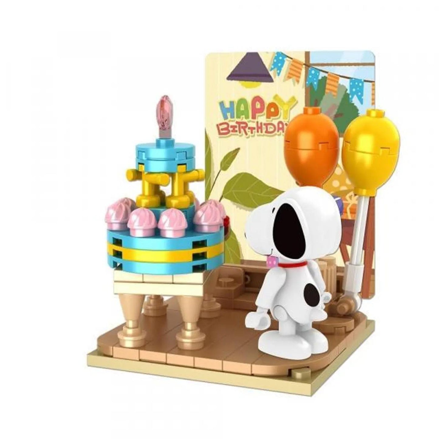 A toy set depicting a birthday scene with a cake, balloons, and a Snoopy figurine.