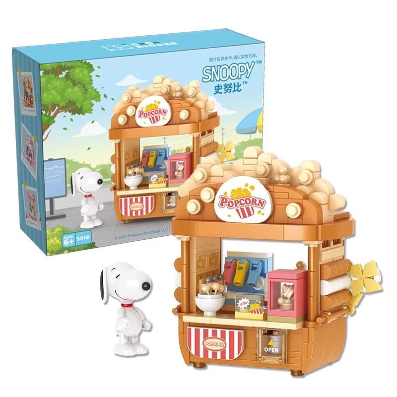A set of building blocks depicting a Popcorn Palace, a popular character from the Peanuts comic strip. The set includes a Popcorn Palace toy and a small toy figure of Snoopy, the beloved character from the Peanuts series.
