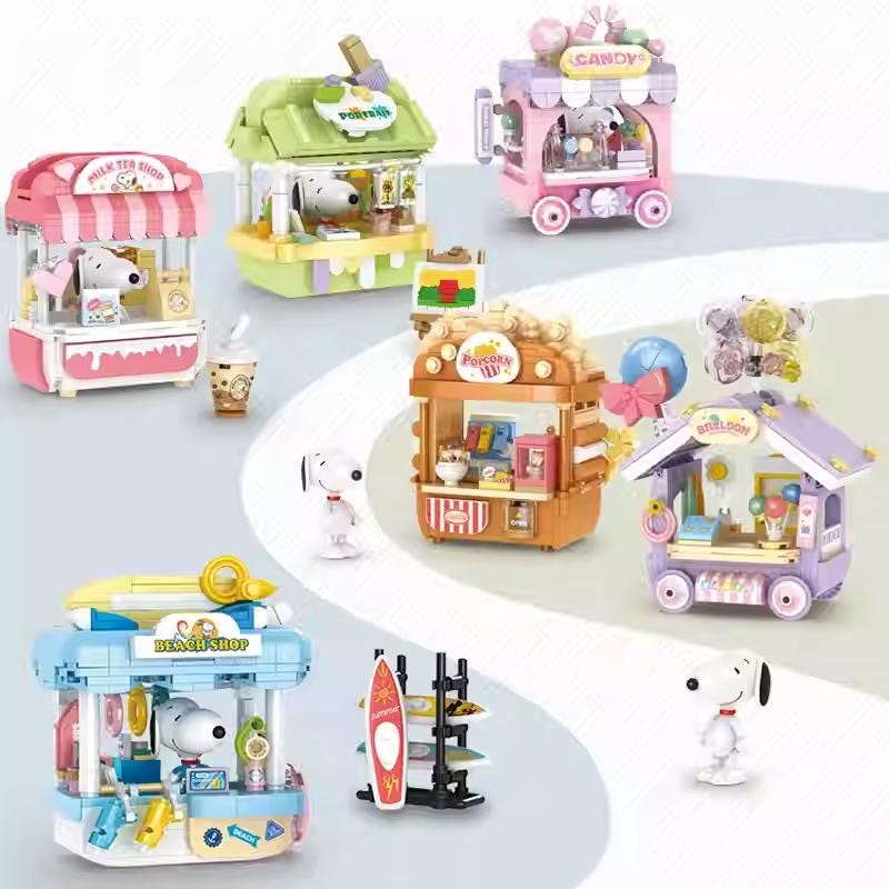 A collection of colorful toy shops and a Snoopy figurine, featuring various miniature items and decorations.