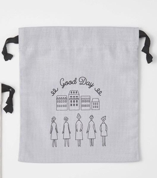 A gray drawstring bag with a black ribbon and a hand-drawn illustration of five people in front of a cityscape.