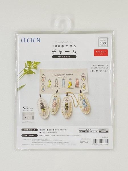 The image is a package of embroidery needles, featuring a clear plastic case with a design of embroidery needles and a pattern.