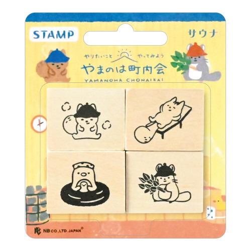 The image is a set of four wooden stamps featuring various cartoon animal illustrations, including a cat, a dog, and a bird.