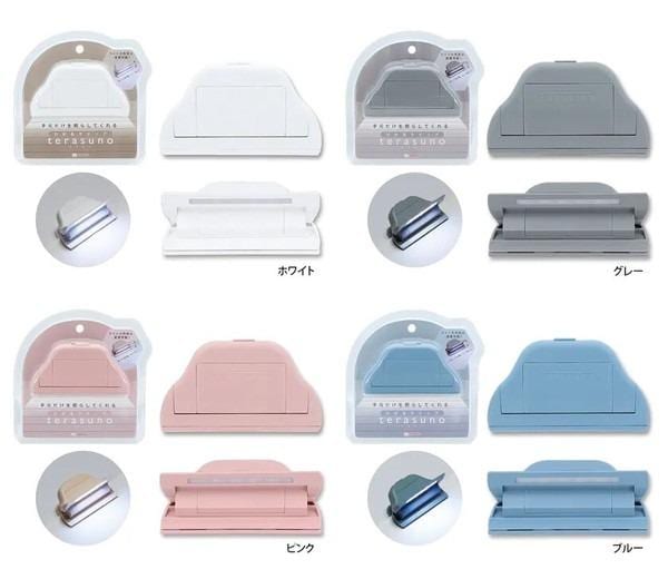 a collection of various colored plastic clamps or holders, each with different designs and patterns.