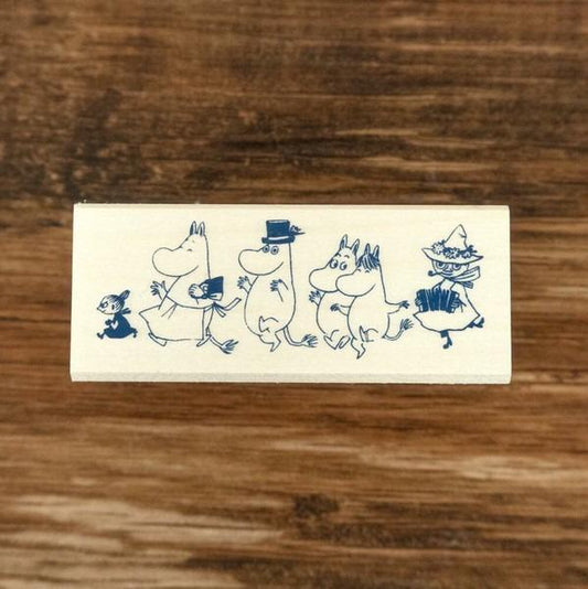 A stamp featuring a group of cartoon characters, including Moom, Moomy, and other miscellaneous figures, all depicted in a whimsical and playful style.