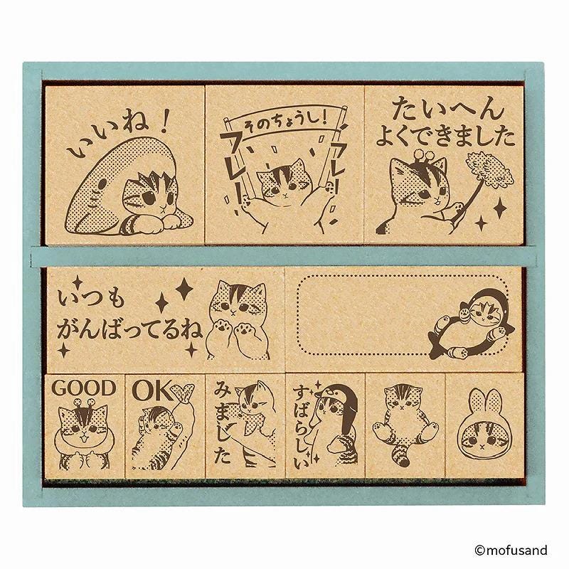 a collection of cartoon-style cat illustrations, each accompanied by Japanese text. The text appears to be in Japanese and is scattered throughout the image, with some phrases like "Good", "OK", and "Great" written alongside the cat illustrations. The collage consists of multiple images, and the phrase "The image depicts", "The image displays", "The image shows", "In the image", "The image captures", "The image