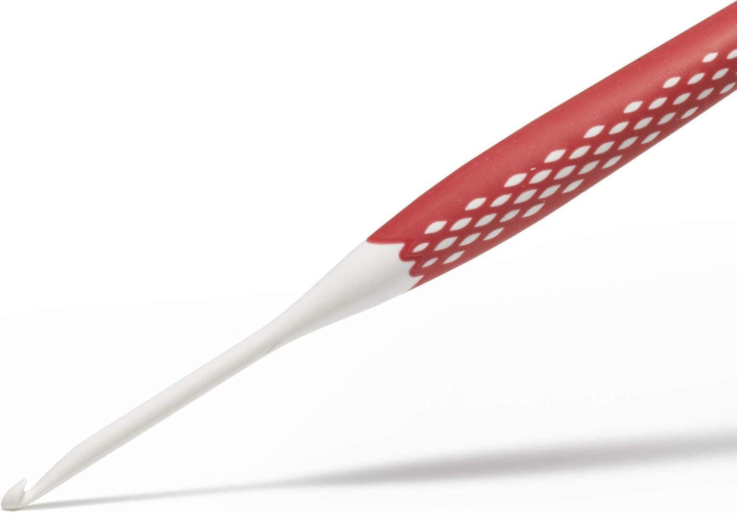 A red crochet hook with a white pattern on the handle is shown against a white background.