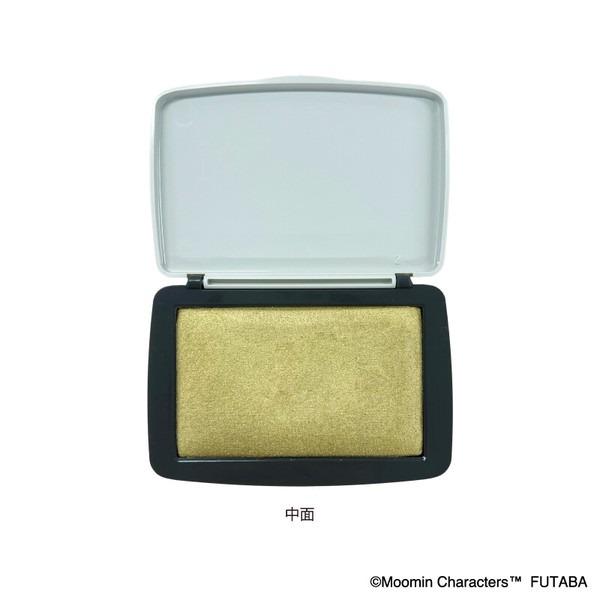 A white and black makeup brush with a gold glittery powder inside.