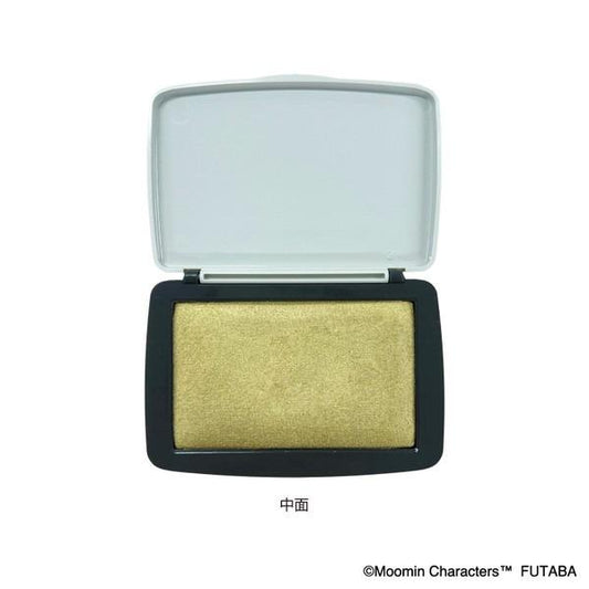 A white and black makeup brush with a gold glittery powder inside.