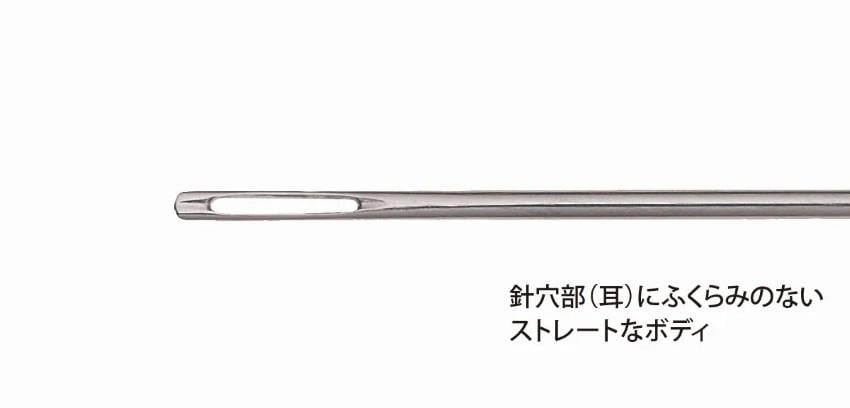 A close-up view of a metal sewing needle with a hole in the center, accompanied by Japanese text.