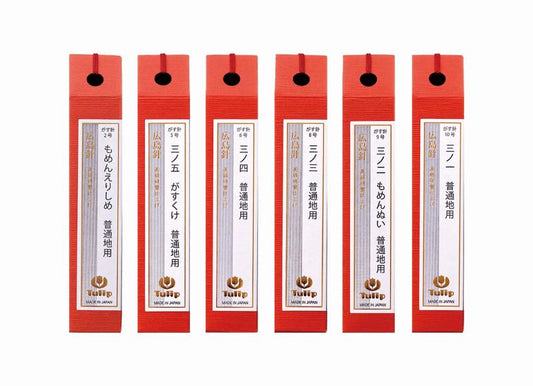 six red boxes with white and gold labels, each containing Japanese text and a logo.