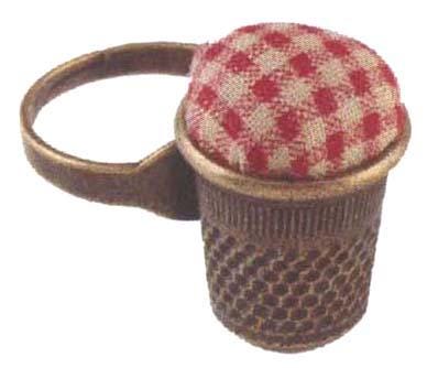 A small metal container with a red and white checkered pattern on top, placed on a white background.