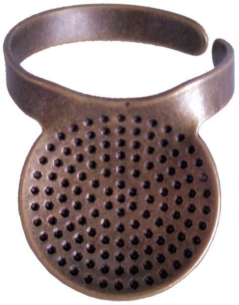 a round, perforated object with a metallic appearance, possibly a tool or accessory.