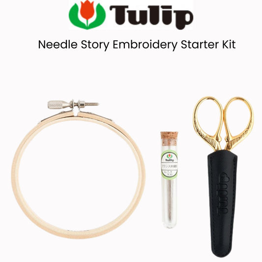 a needle story embroidery starter kit, including a hoop, a pair of scissors, and a tube of thread.