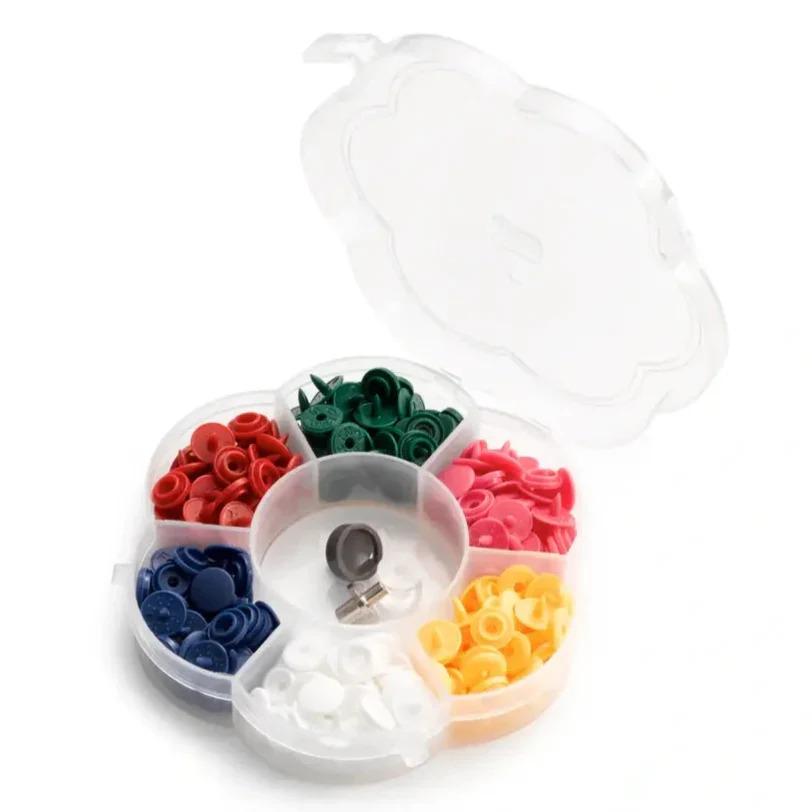 A clear plastic container with compartments filled with various colored plastic buttons, including red, green, blue, pink, yellow, and white buttons.